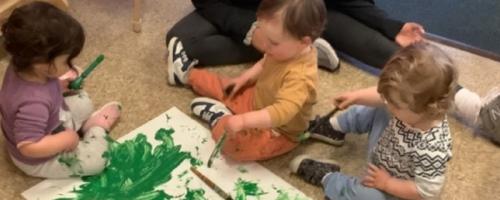 Group of young children painting