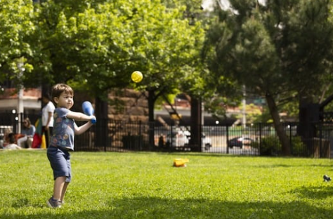 Boy hitting wiffle ball